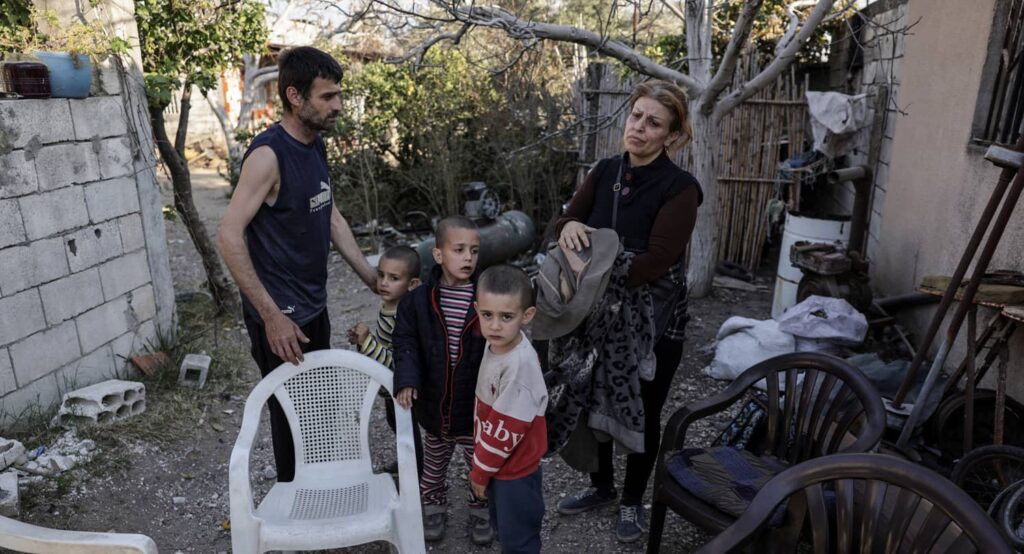 Alawite family returns to their home in Latakia, Syria from sanctuary at the Russian air base, March 2025. Photo credit: REUTERS/Khalil Ashawi.