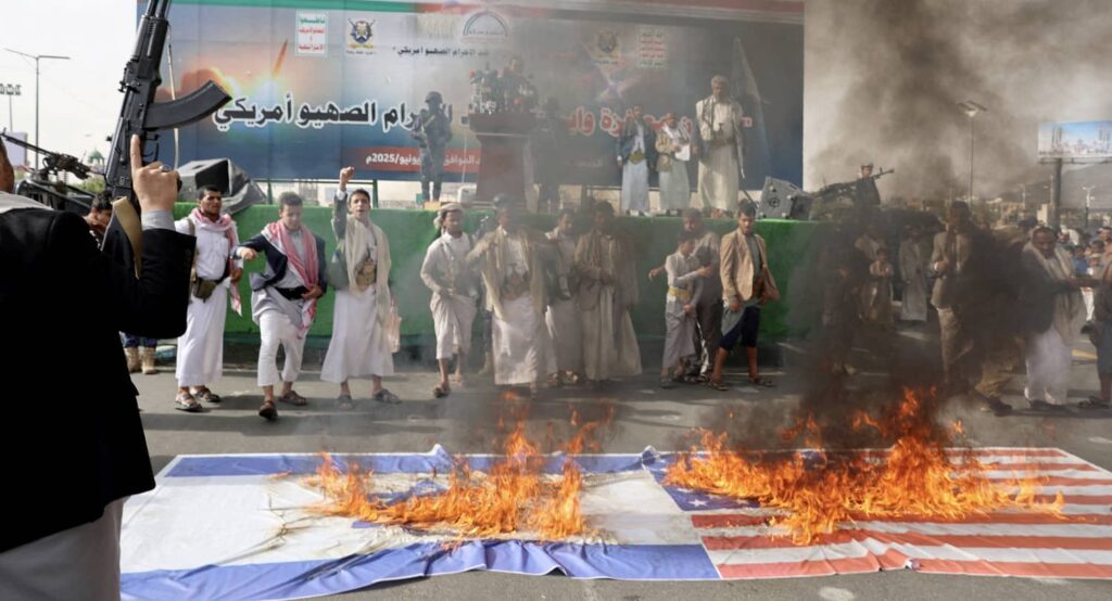 Houthi supporters burn Israeli and US flags in Sanaa, Yemen, June 20, 2025. Photo credit: REUTERS/Khaled Abdullah.